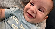 Alex is registered to the contest to win money with this photo: baby, smile, face, child, person, tshirt, clothing, joy, happy, closeup, infant, skin, head, eyes, mouth, expression, human, portrait, casual, holding