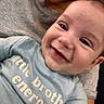 baby, smile, face, child, person, tshirt, clothing, joy, happy, closeup, infant, skin, head, eyes, mouth, expression, human, portrait, casual, holding