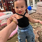 Gianna Minulwan is registered to the contest to win money with this photo: baby, balloon, bread, clothing, face, food, footwear, furniture, happy, head, indoors, jeans, pants, person, photography, portrait, shoe, sitting, smile, table
