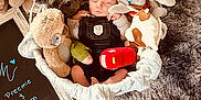 Drakeson is registered to the contest to win money with this photo: baby, bed, bodypart, clothing, face, finger, furniture, hand, hat, head, homedecor, newborn, person, photography, plush, portrait, sleeping, teddybear, text, toy