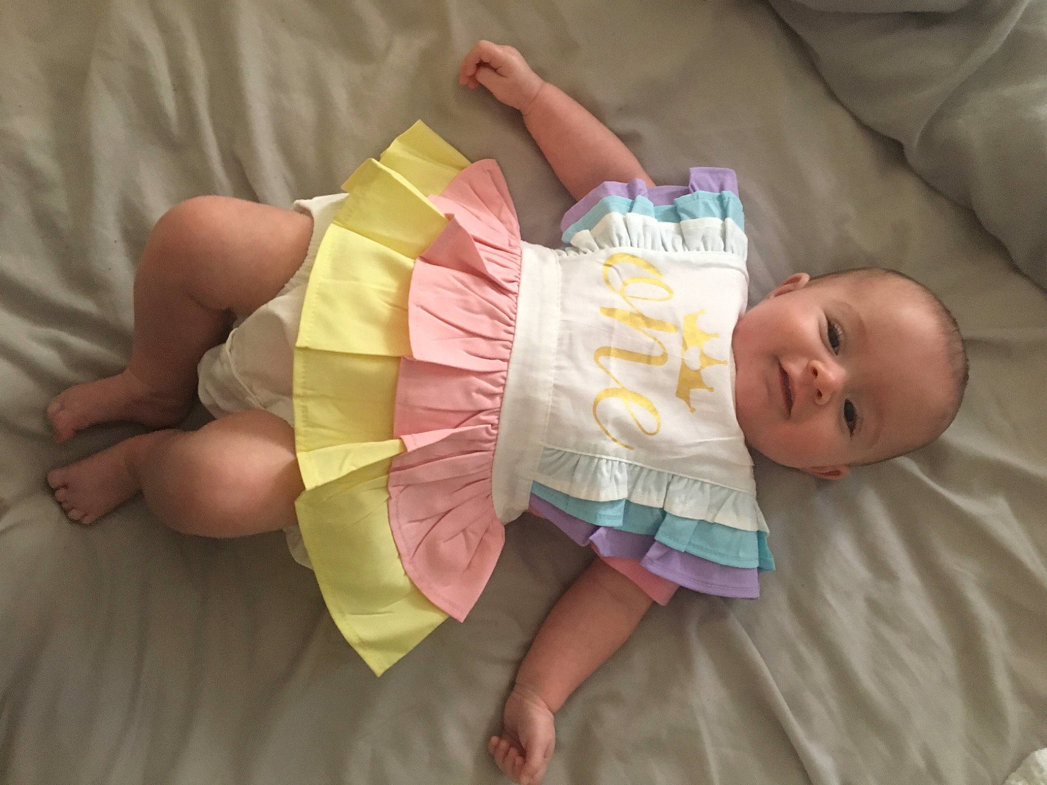 Dollie is registered to the contest to win money with this photo: abdomen, baby, baby_products, baby_toddler_clothing, bedtime, child, comfort, finger, hand, linens, nail, paper, paper_product, person, room, thumb, toddler, wrist