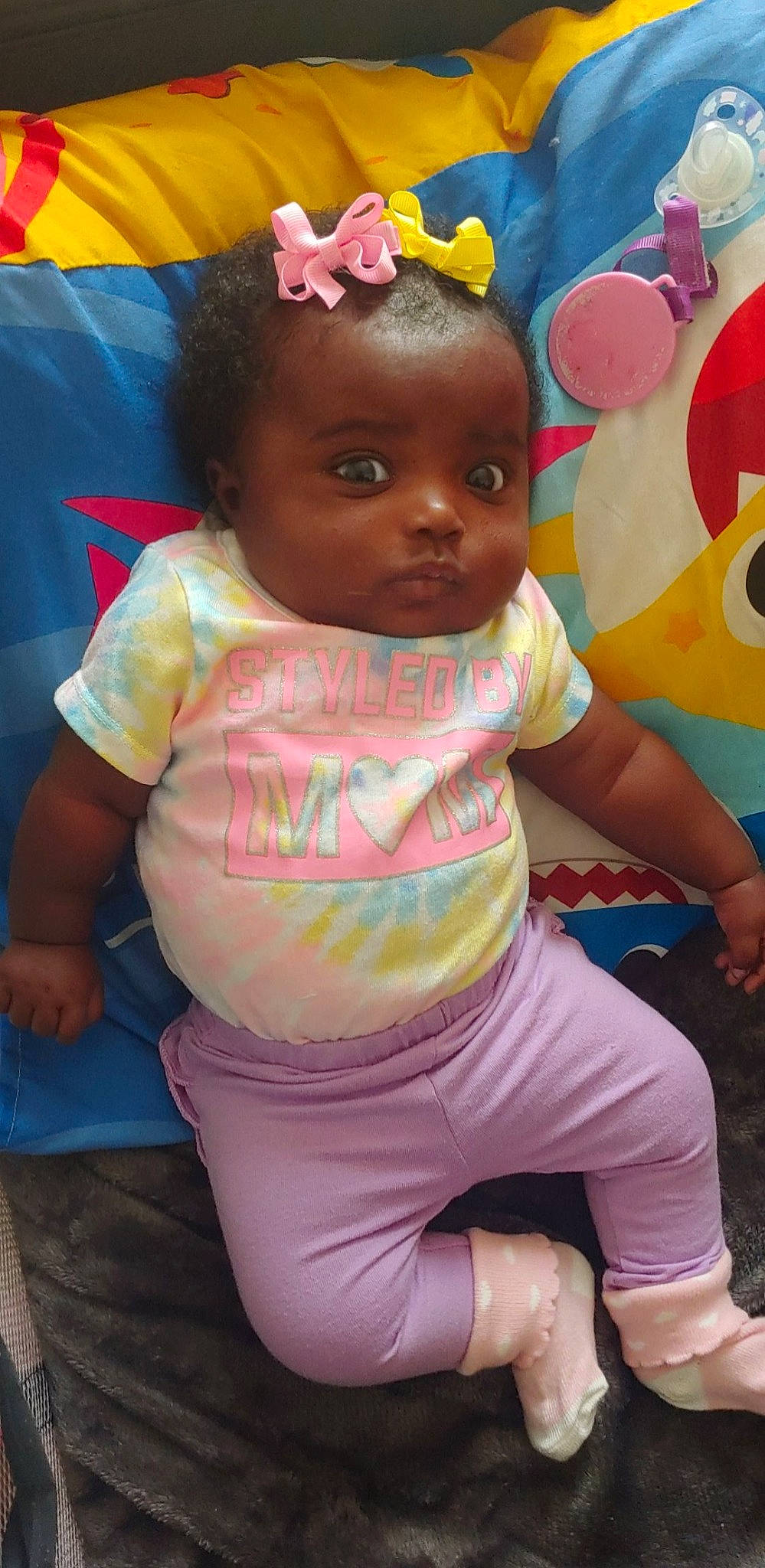 Nevaeh is registered to the contest to win money with this photo: baby_toddler_clothing, cheek, child, facial_expression, fun, hairstyle, happy, human, human_body, leisure, lip, magenta, mouth, organ, person, pink, skin, t_shirt, thigh, toddler