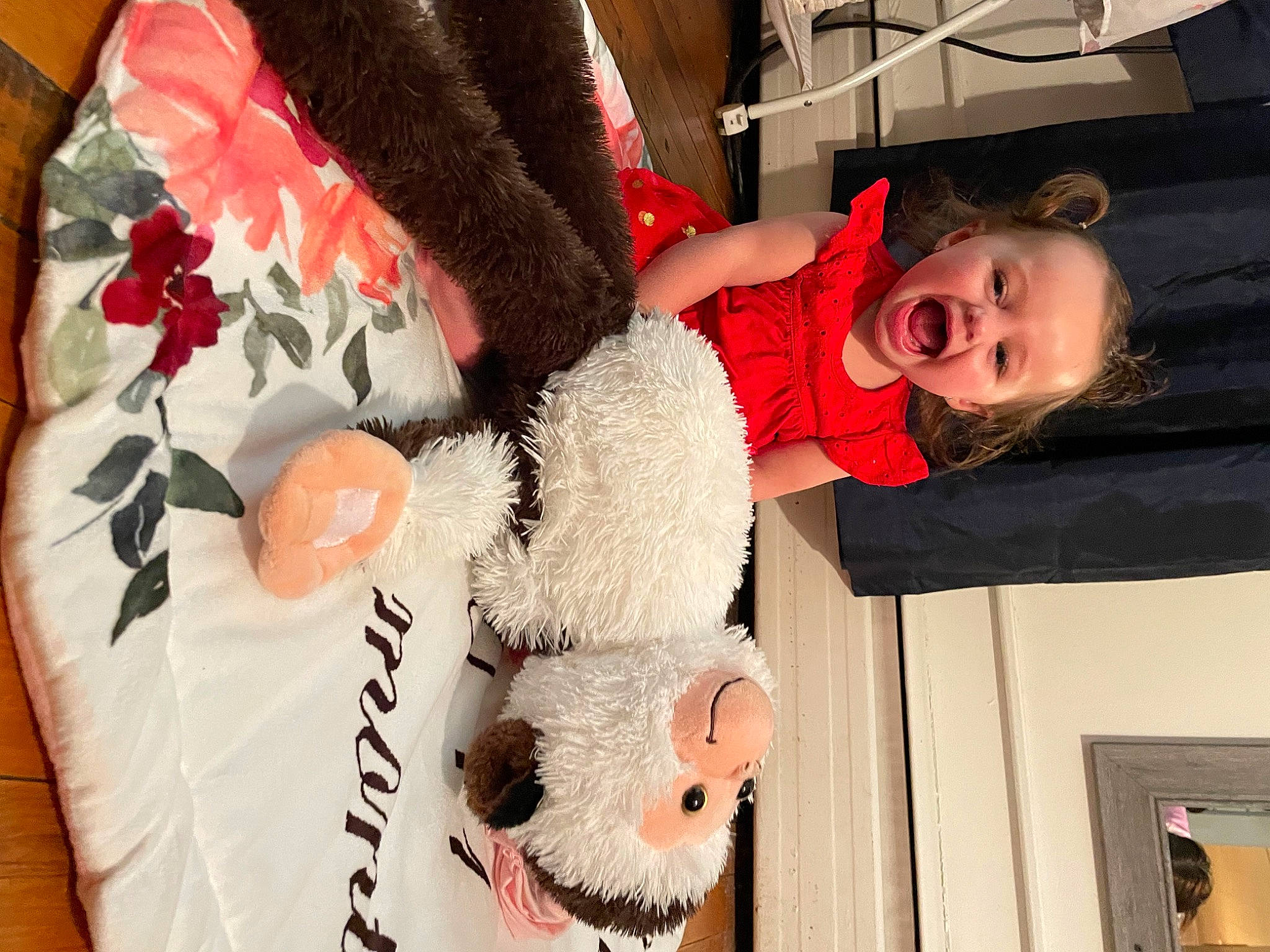 Delaney is registered to the contest to win money with this photo: carmine, child, costume, event, fur, linens, pattern, person, pink, plush, room, sleeve, smile, stuffed_toy, teddy_bear, textile, toddler, toy, tree, white