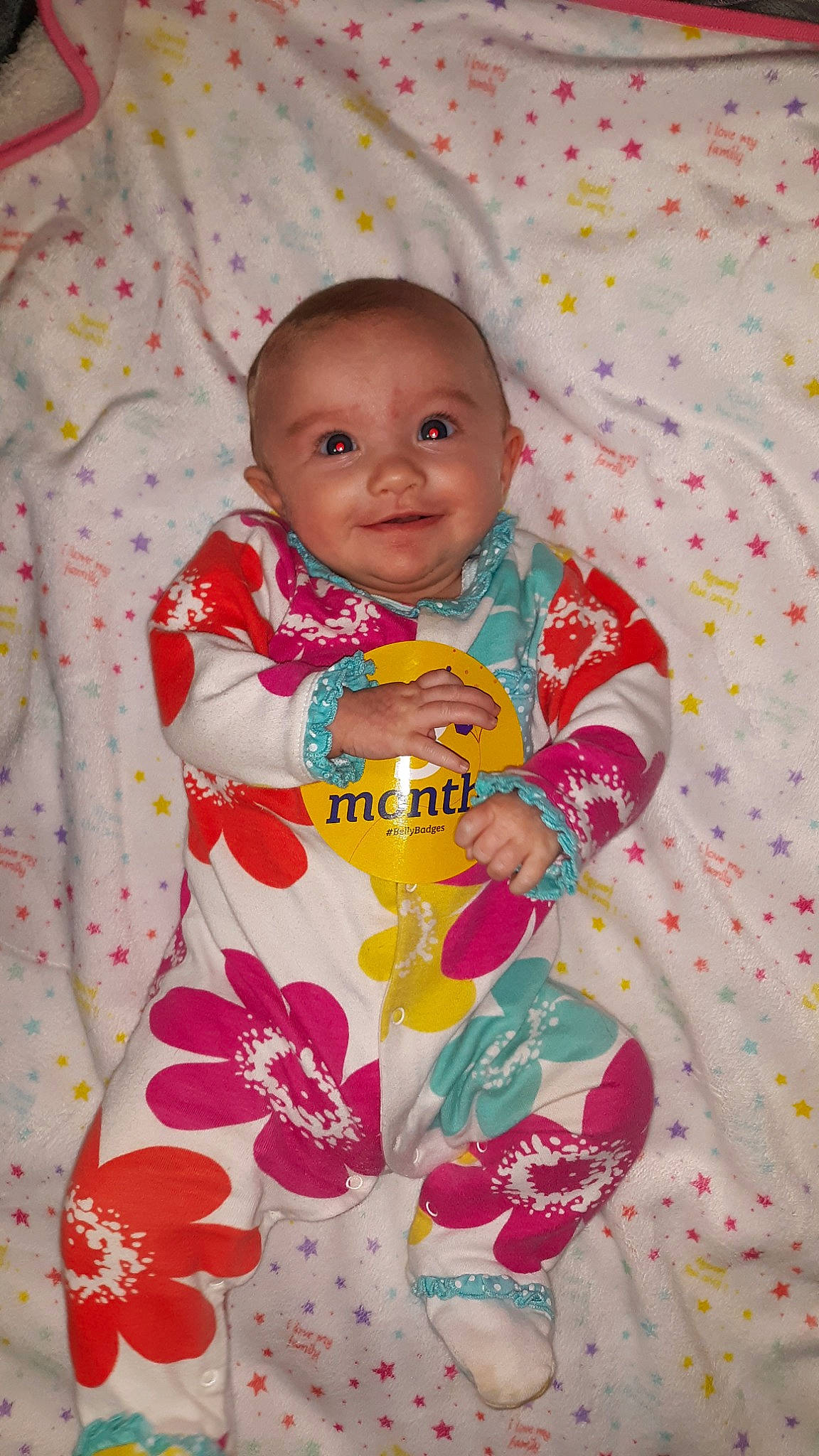 Ayla is registered to the contest to win money with this photo: baby, baby_products, baby_safety, baby_toddler_clothing, cheek, child, dress, eye, face, happy, joy, linens, outerwear, pattern, person, pink, product, skin, sleeve, smile