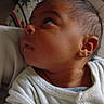 baby, blanket, child, cozy, curious, ear, expression, face, head, human, indoors, infant, looking_up, newborn, person, portrait, seated, skin, white_clothing, young_child