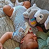 ézéchiel participe au concours pour gagner de l'argent avec cette photo : adorable, baby, child, couch, cozy, cute, home, indoor, infant, peaceful, plush_toy, portrait, relaxation, resting, shoes, sleeping, socks, soft_toys, striped_onesie, stuffed_animal