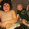 James is registered to the contest to win money with this photo: child, baby, smile, couch, blanket, pillow, indoor, toy, onesie, shirtless, happy, relaxing, home, infant, sibling, cozy, face, person, furniture, cute