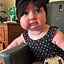 Scarlet joined the competition — help win amazing prizes! baby, child, headwrap, black_bow, onesie, high_chair, face, cheeks, food_residue, indoor, furniture, curious, seated, infant, expression, skin, arm, leg, household_items, portrait