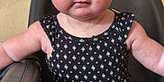 Scarlet joined the competition — help win amazing prizes! baby, child, high_chair, black_bow, headwrap, patterned_clothing, straps, chubby_cheeks, wide_eyes, curious, indoor, seat, furniture, person, infant, cute, expression, arm, legs, closeup