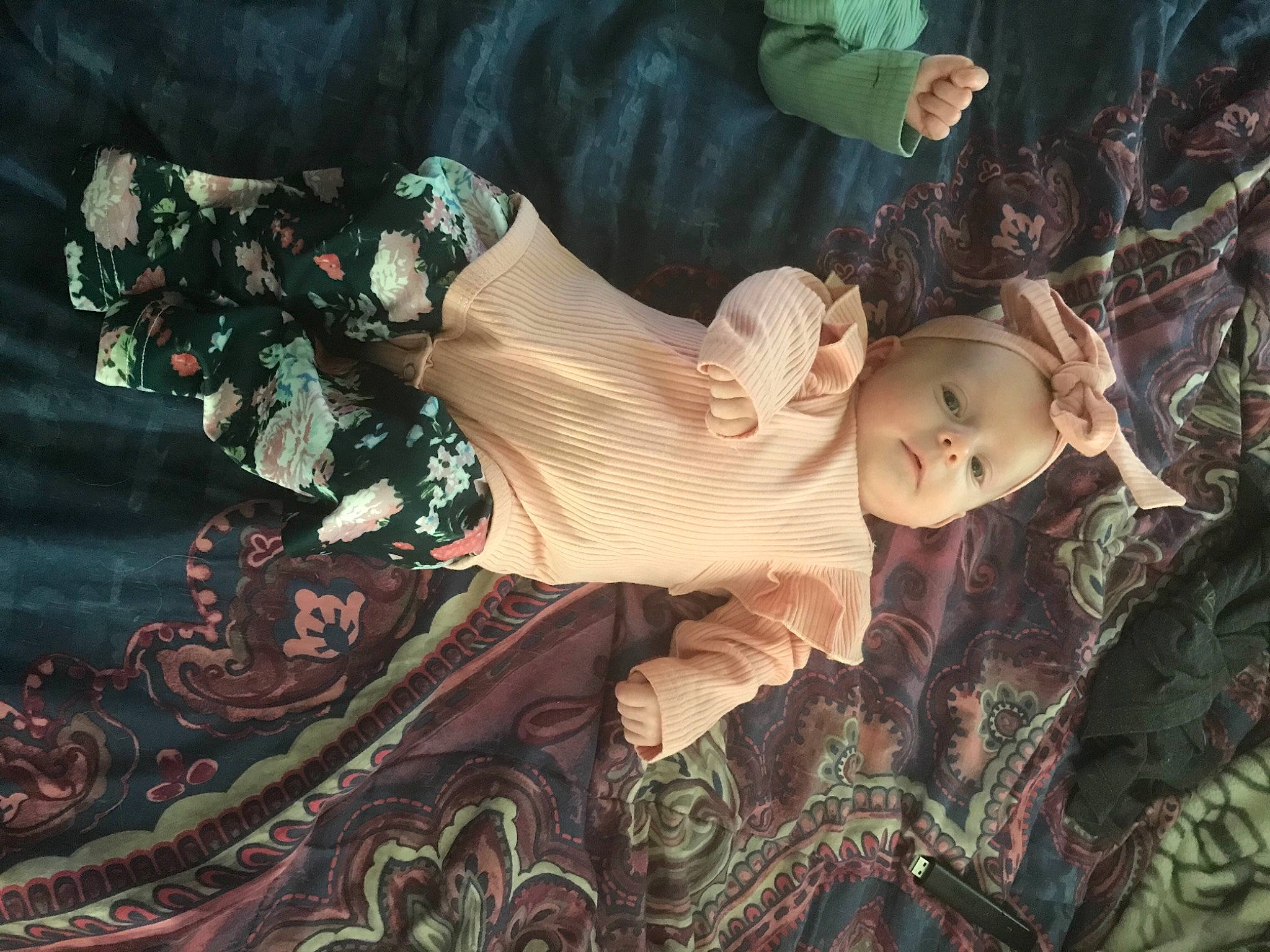 Apryl is registered to the contest to win money with this photo: baby, cg_artwork, child, costume, doll, dress, event, fawn, fictional_character, fun, grass, human_body, pattern, person, plant, sitting, toddler, toy, tradition, tree