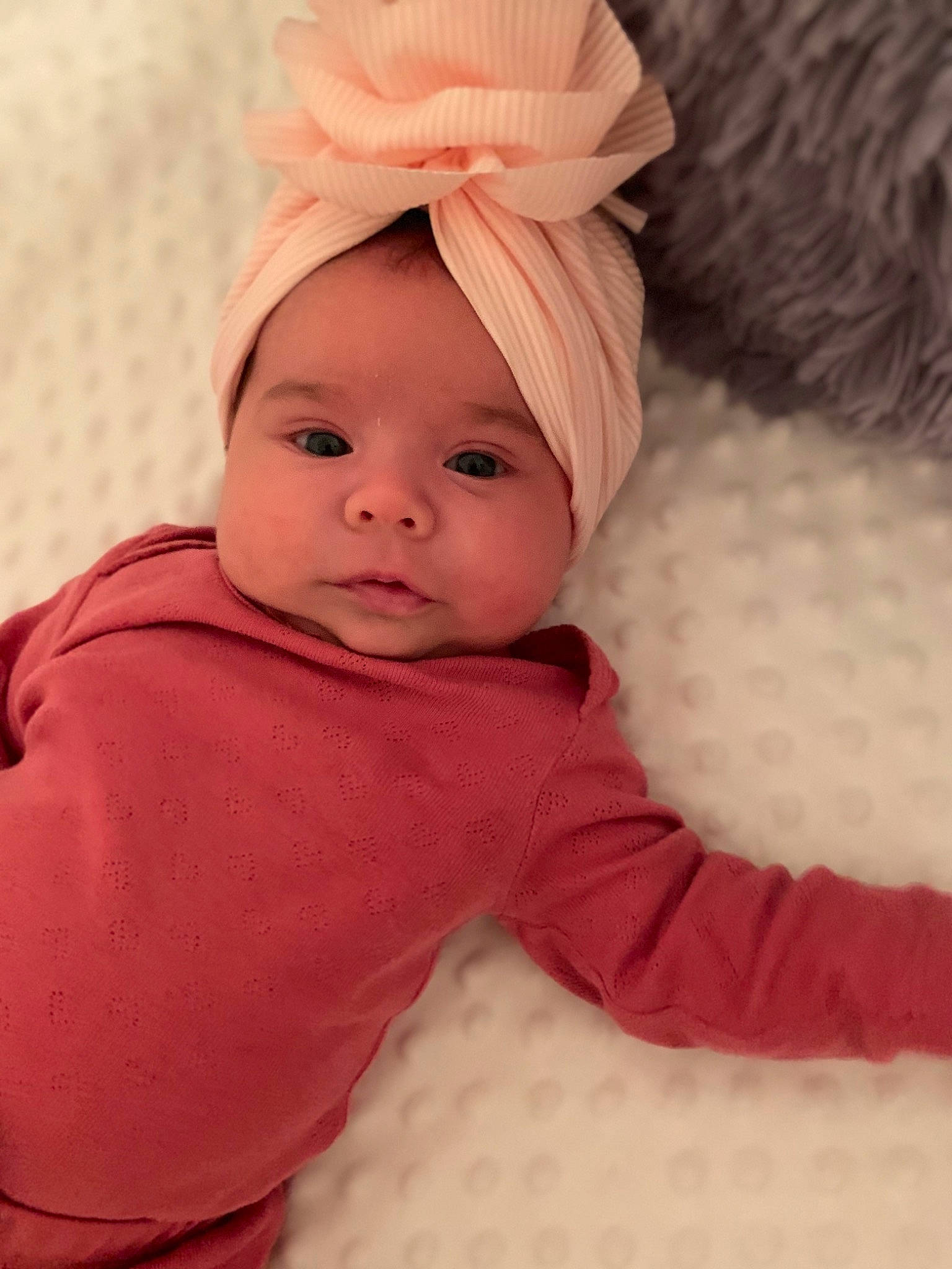 Bianca is registered to the contest to win money with this photo: baby, baby_toddler_clothing, bonnet, cheek, child, child_model, comfort, costume_accessory, headband, headwear, hood, lip, nose, peach, person, pink, portrait_photography, skin, sleeve, textile