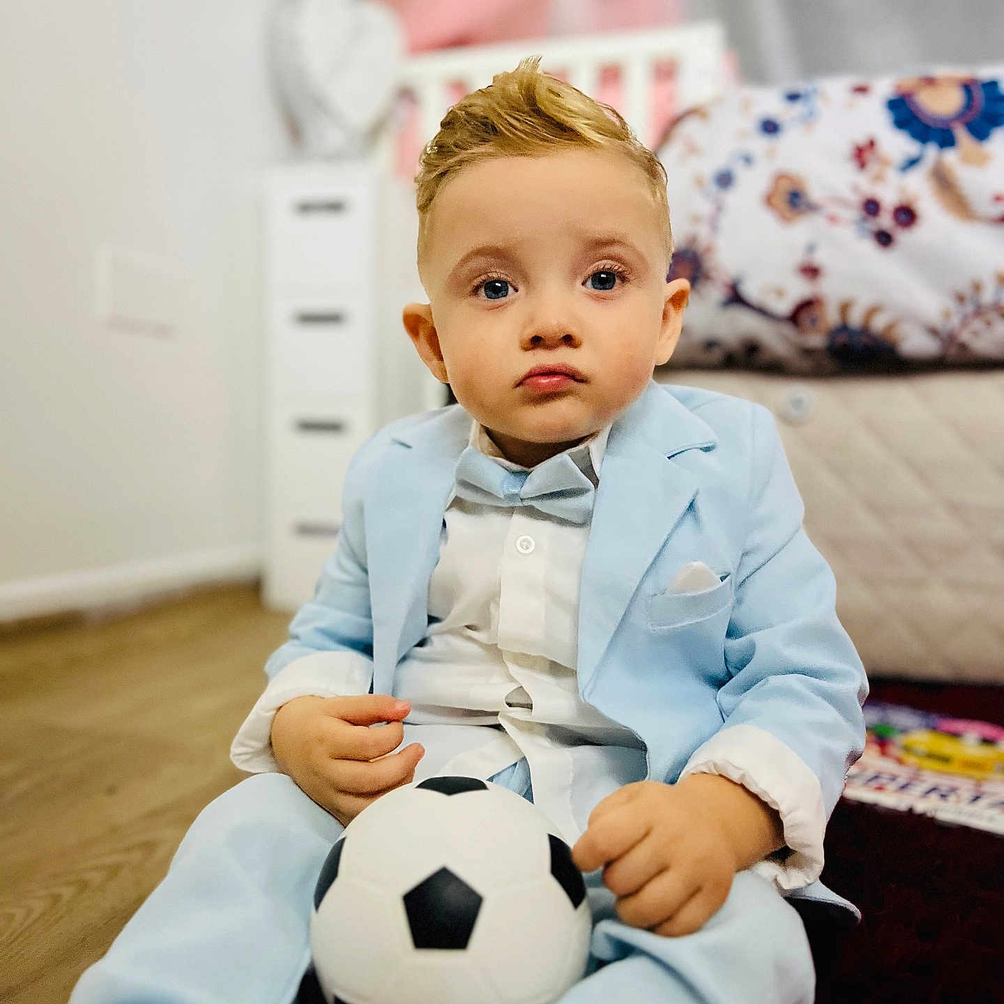 Iacov Isac Vasile joined the competition — help win amazing prizes! bed, blanket, bow_tie, boy, carpet, child, clothing, cute, dresser, flowers, furniture, home, indoor, person, portrait, serious_expression, soccer_ball, suit, vase, wooden_floor