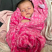 Ava-Grace Miles joined the competition — help win amazing prizes! baby, blanket, chair, child, comfort, cozy, cushion, cute, fabric, face, indoors, infant, peaceful, pink, portrait, resting, sleeping, soft, toddler, wrapped