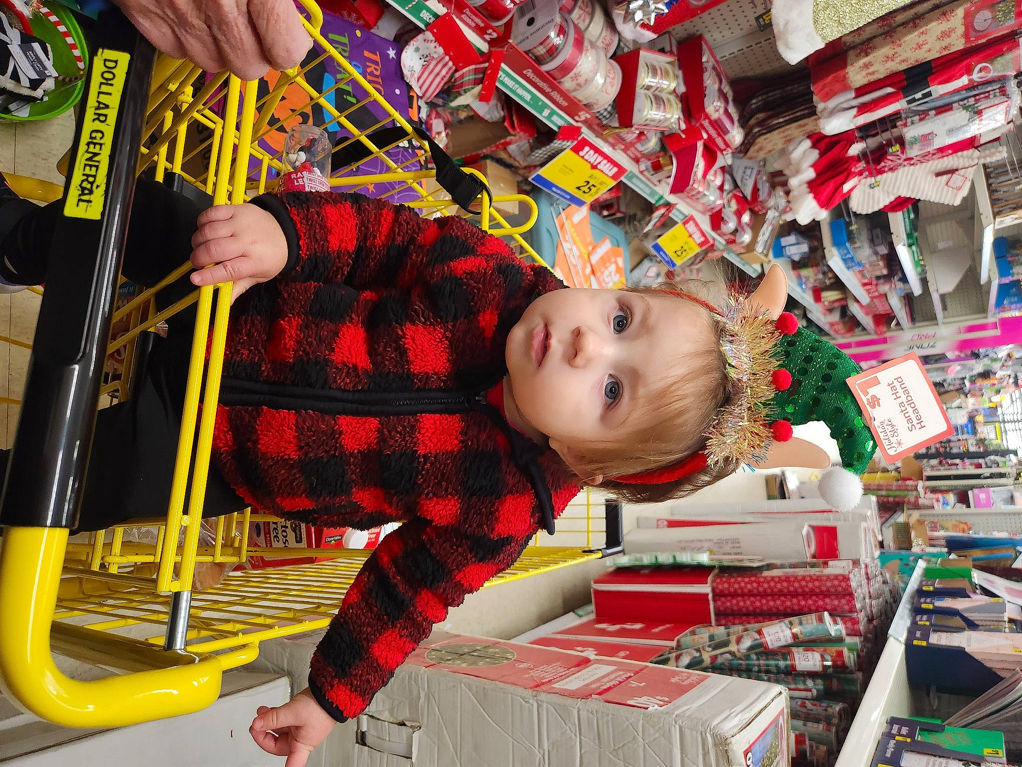 Madeline is registered to the contest to win money with this photo: baby, child, city, event, fun, holiday, human_settlement, leisure, market, marketplace, pattern, person, plaid, public_space, retail, shopping, tartan, textile, toddler, toy