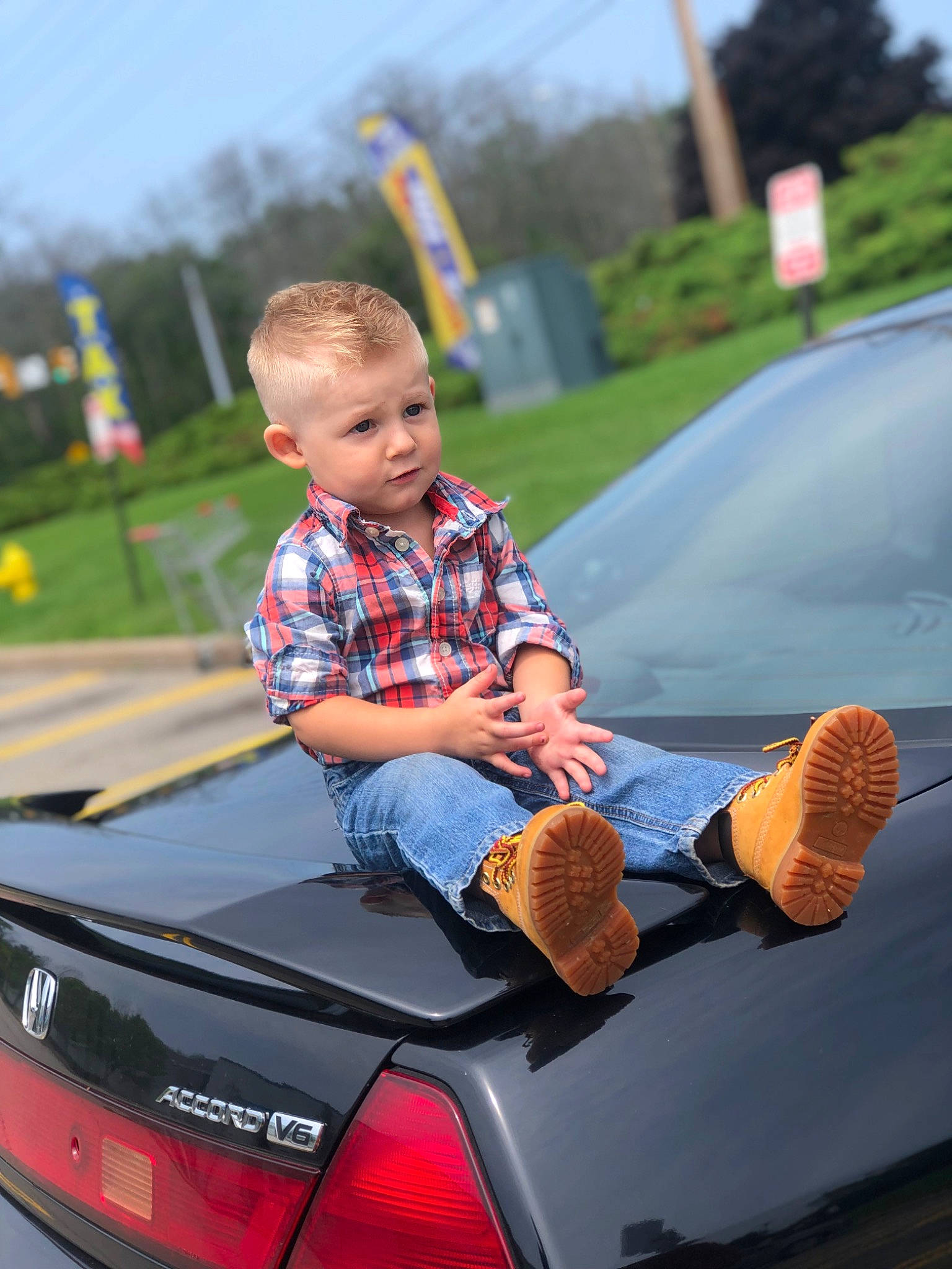 Blayke is registered to the contest to win money with this photo: automotive_design, automotive_exterior, automotive_lighting, automotive_tail_brake_light, bumper, car, hood, jeans, mode_of_transport, motor_vehicle, person, personal_luxury_car, shirt, sky, t_shirt, tints_and_shades, toddler, tree, trunk, vehicle