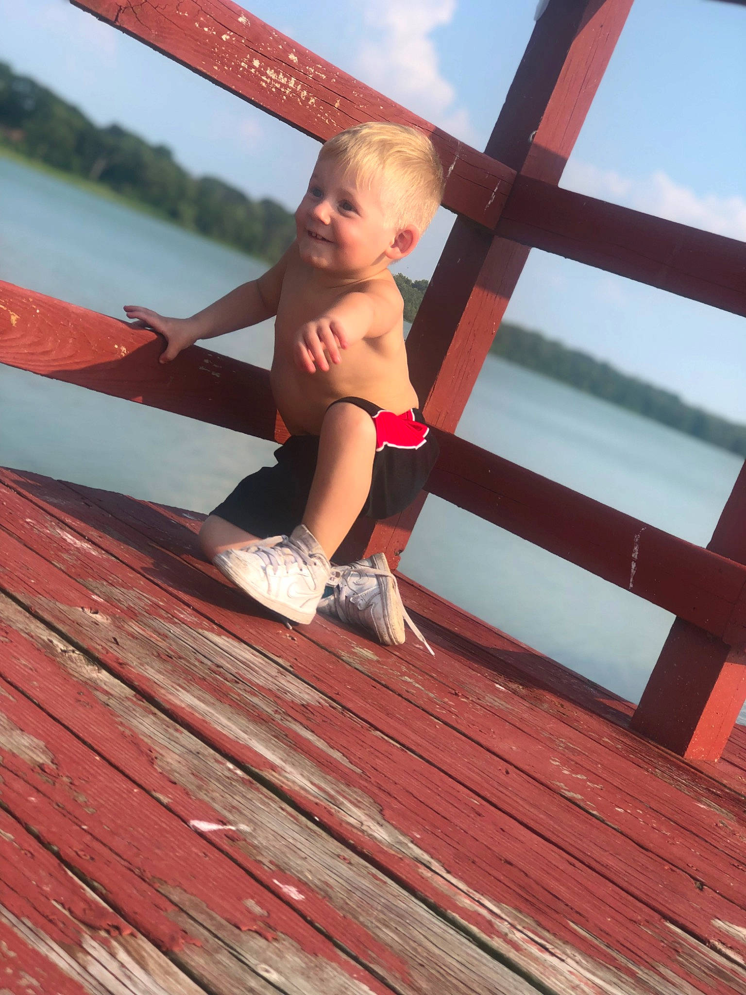 Blayke is registered to the contest to win money with this photo: barefoot, dock, foot, fun, happy, hardwood, human_body, human_leg, joy, lake, leg, leisure, muscle, person, plank, red, sky, thigh, travel, water