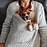 Shadow a rejoint le concours — aidez-le/la à gagner de superbes lots ! woman, glasses, braids, sweater, puppy, dog, couch, indoor, cozy, pet, casual, seated, relaxed, brown_dog, white_paws, knitted_sweater, portrait, home, comfort, cute