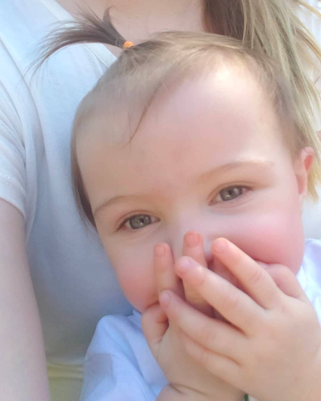 Mira is registered to the contest to win money with this photo: baby, cheek, child, chin, close_up, ear, eye, eyebrow, eyelash, face, finger, forehead, gesture, hand, head, joy, lip, mouth, nose, person