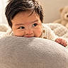 baby, infant, child, portrait, face, eyes, smiling, happy, indoor, cozy, blanket, cushion, pillow, knitwear, sweater, teddy_bear, soft, warm_lighting, close_up, sitting