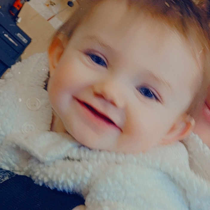 Georgia joined the competition — help win amazing prizes! baby, background, child, closeup, cozy, cute, face, fluffy, happy, home, indoor, infant, jacket, no_parking, person, portrait, sign, smiling, warm, white