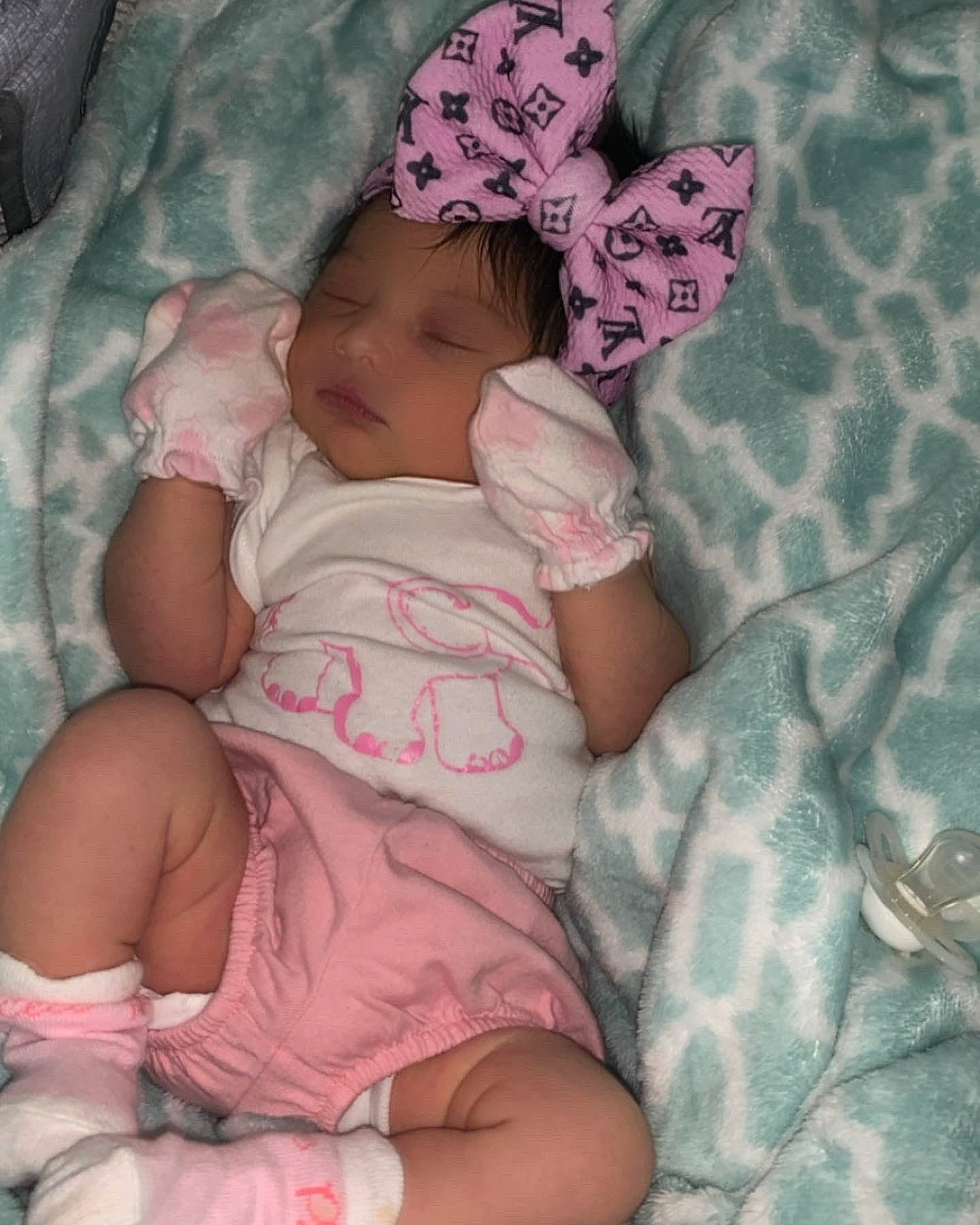 Xa'Layaa joined the competition — help win amazing prizes! arm, baby, baby_toddler_clothing, cheek, comfort, eye, hand, head, headgear, human_body, leg, linens, mouth, person, pink, product, skin, sleeve, textile, thigh