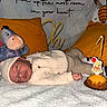 baby, bedroom, birthday_cake, blanket, candle, celebration, cozy, eeyore, hat, infant, knitwear, pillow, shoes, sleeping, socks, soft_toys, stuffed_toy, white, winnie_the_pooh, yellow
