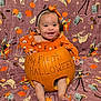 Maxyne is registered to the contest to win money with this photo: baby, pumpkin, halloween, orange_clothing, headband, smiling, holiday, blanket, ghost, skeleton, costume, infant, cute, celebration, festive, autumn, child, portrait, happy, seasonal