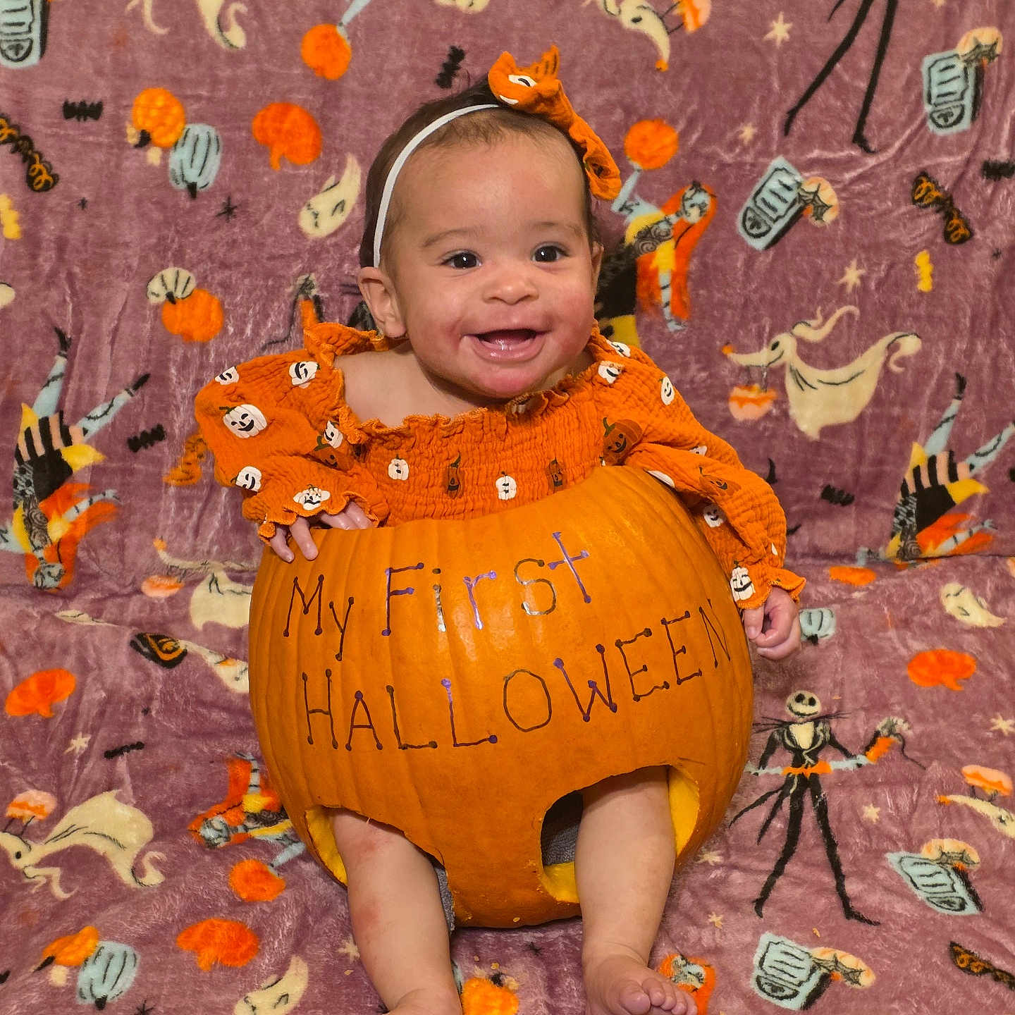 Maxyne is registered to the contest to win money with this photo: autumn, baby, blanket, celebration, child, costume, cute, festive, ghost, halloween, happy, headband, holiday, infant, orange_clothing, portrait, pumpkin, seasonal, skeleton, smiling