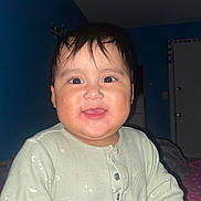 Dylan is registered to the contest to win money with this photo: baby, bedroom, button, buttoned_clothing, cheerful, child, cute, door, face, happy, human, indoor, infant, light_green, onesie, person, portrait, smile, wall, young_child