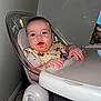 baby, high_chair, bib, food, messy_face, infant, indoor, plastic, table, hands, cute, feeding, child, face, expression, clothing, kitchen, smile, young, person
