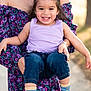 toddler, child, smiling, happy, person, adult, holding, purple_top, blue_jeans, colorful_socks, outdoor, sunlight, floral_dress, portrait, cute, joyful, casual_clothing, nature, family, playful