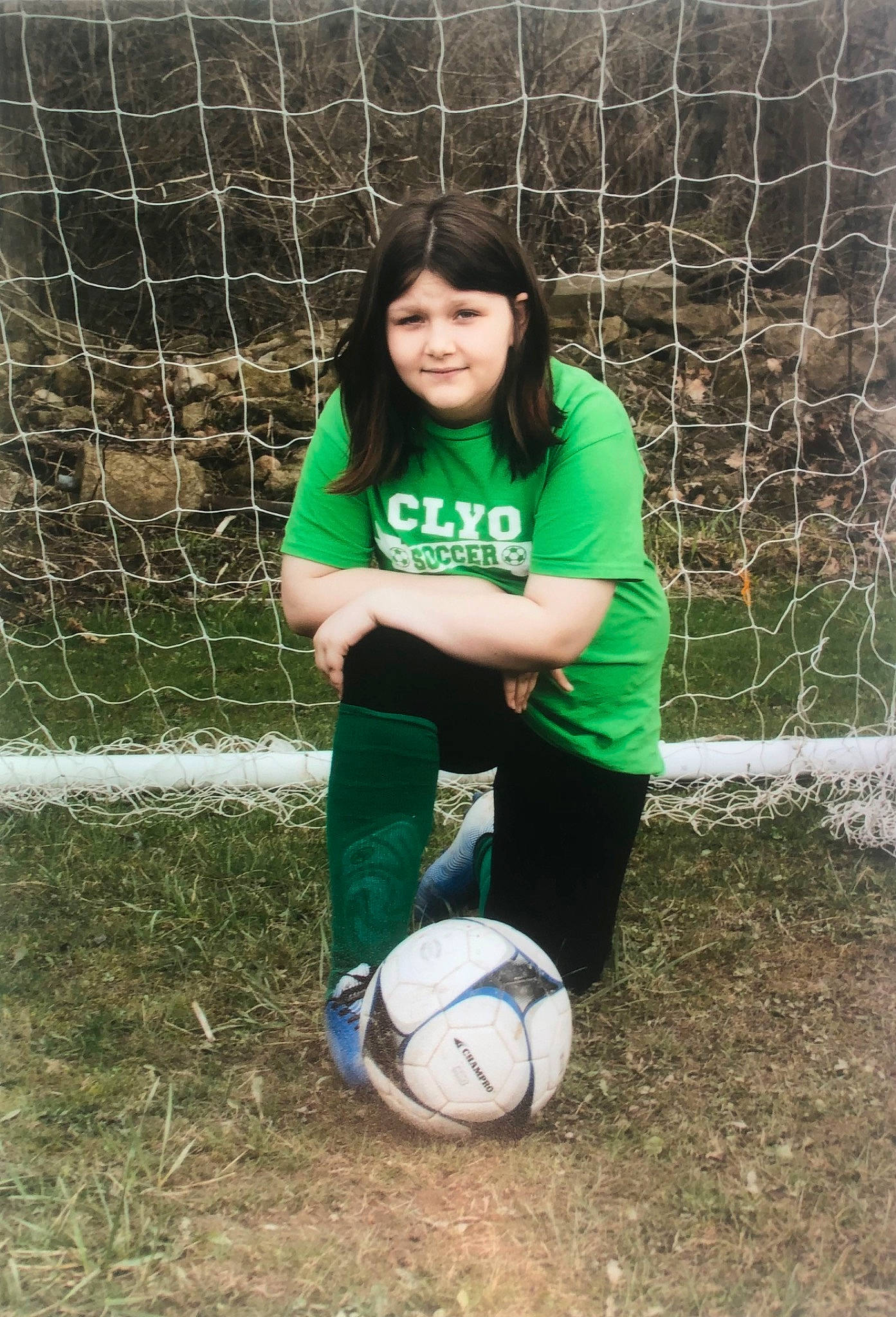 Ariel joined the competition — help win amazing prizes! ball, fence, football, grass, joy, mammal, mesh, nature, net, people_in_nature, person, player, smile, soccer, soccer_ball, sports, sports_equipment, t_shirt, team_sport, thigh