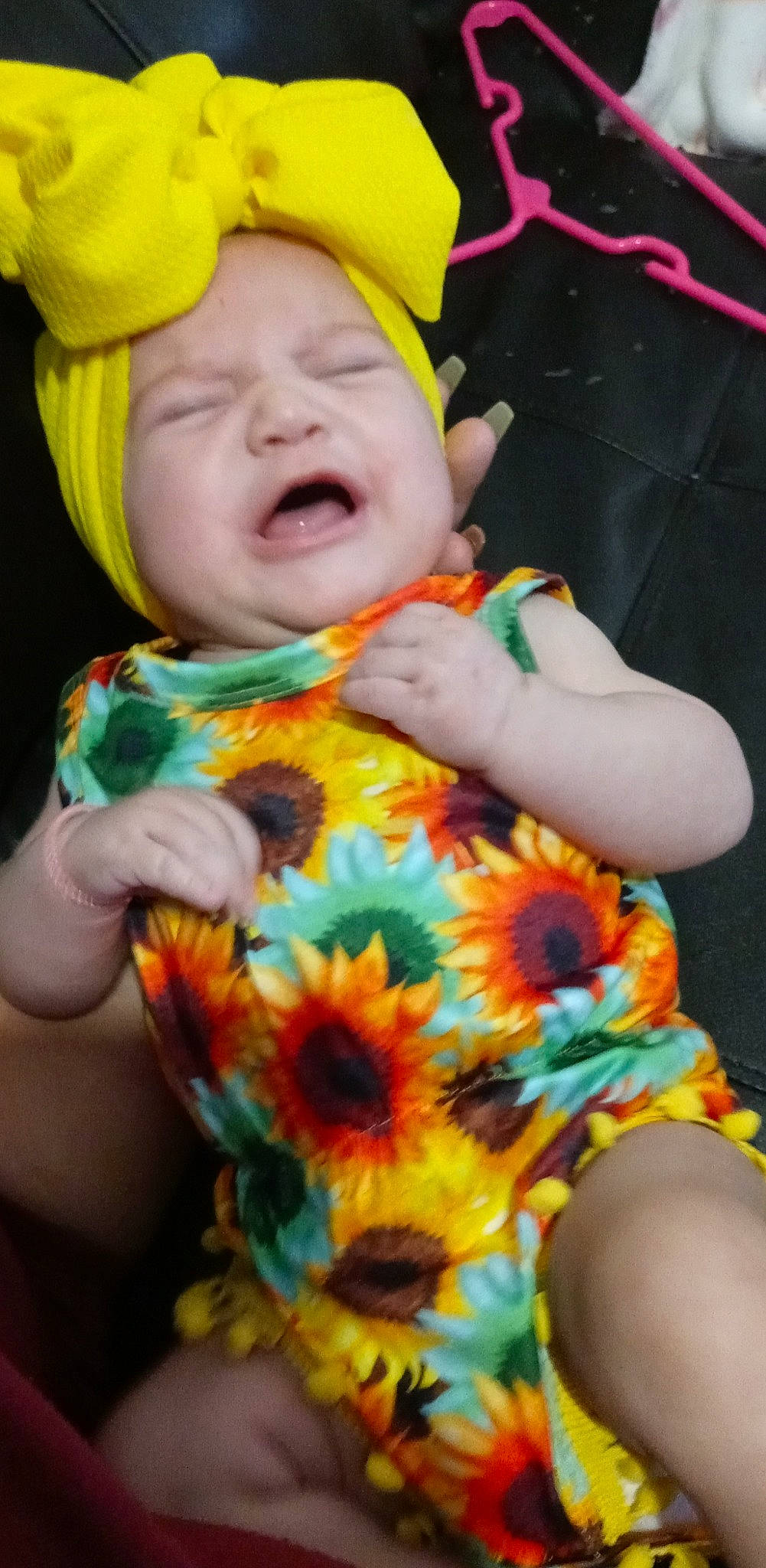 Kassidy is registered to the contest to win money with this photo: eye, face, facial_expression, flower, green, hand, happy, head, headgear, human_body, leaf, mouth, muscle, orange, organ, organism, person, photograph, plant, skin