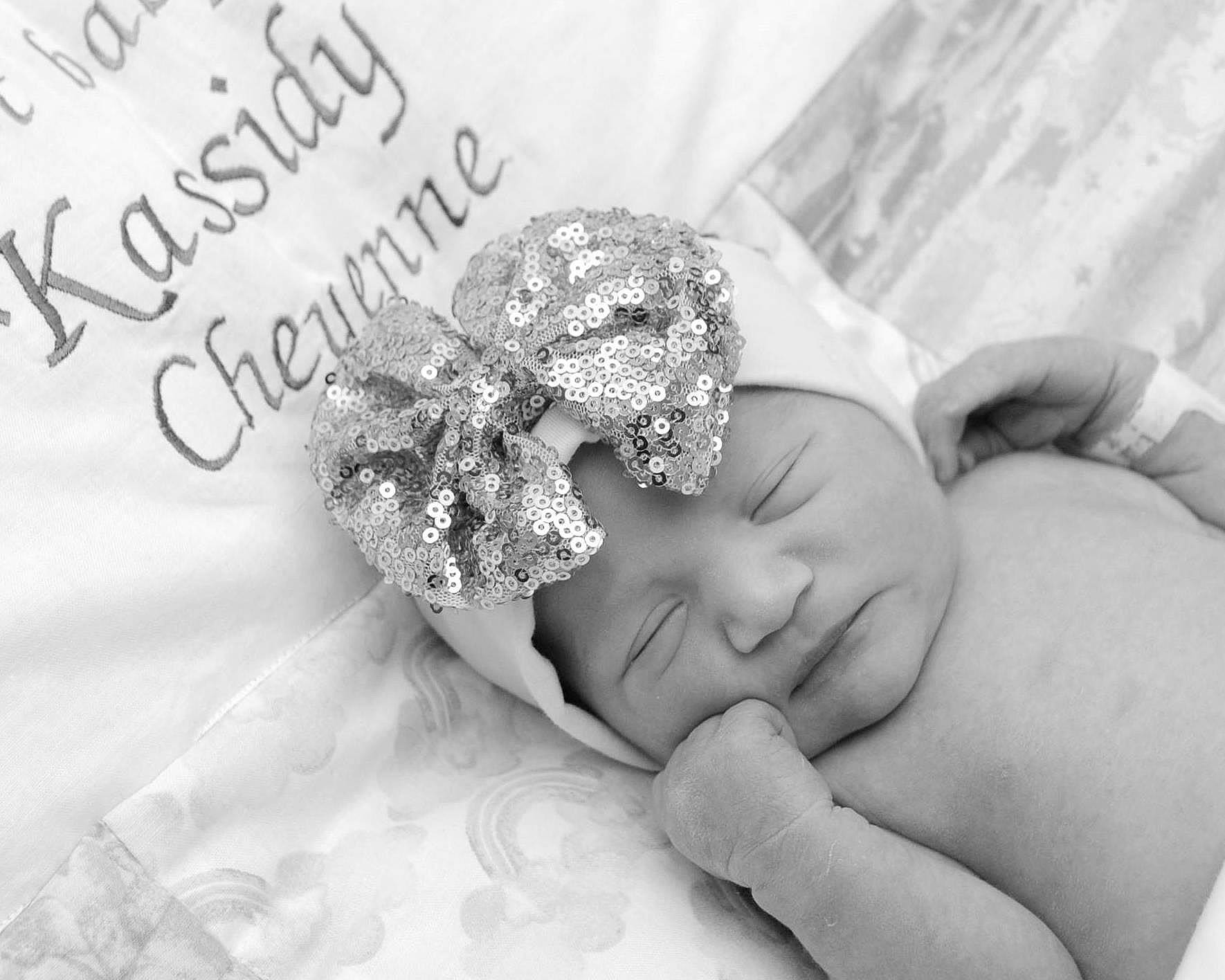Kassidy joined the competition — help win amazing prizes! baby, black_and_white, close_up, comfort, event, finger, flash_photography, font, gesture, happy, headpiece, interaction, jewellery, monochrome, monochrome_photography, nail, person, petal, style, toddler