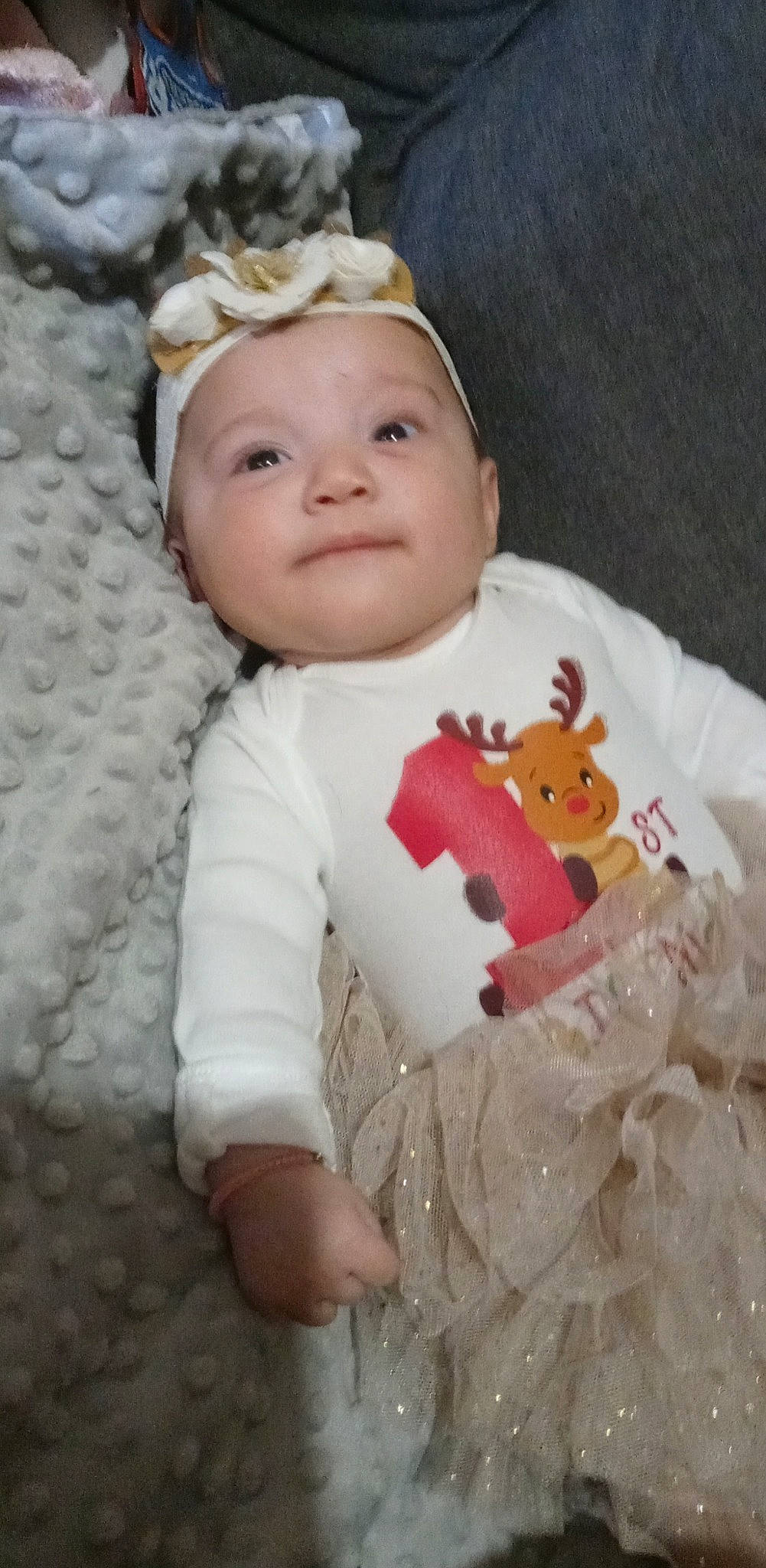 Kassidy is registered to the contest to win money with this photo: baby, baby_toddler_clothing, cheek, child, eye, face, facial_expression, fur, happy, head, headband, headgear, headwear, human_body, lip, nose, outerwear, person, skin, sleeve