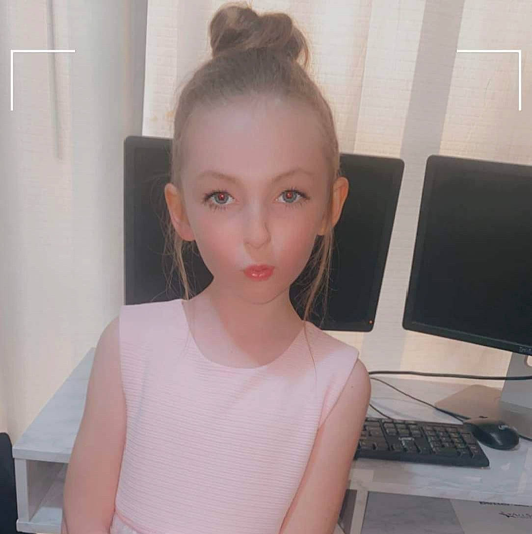 Emma is registered to the contest to win money with this photo: blond, bun, computer, computer_desk, computer_keyboard, computer_monitor, desk, ear, eyelash, fashion_design, forehead, input_device, jaw, long_hair, neck, netbook, office_equipment, output_device, peripheral, person