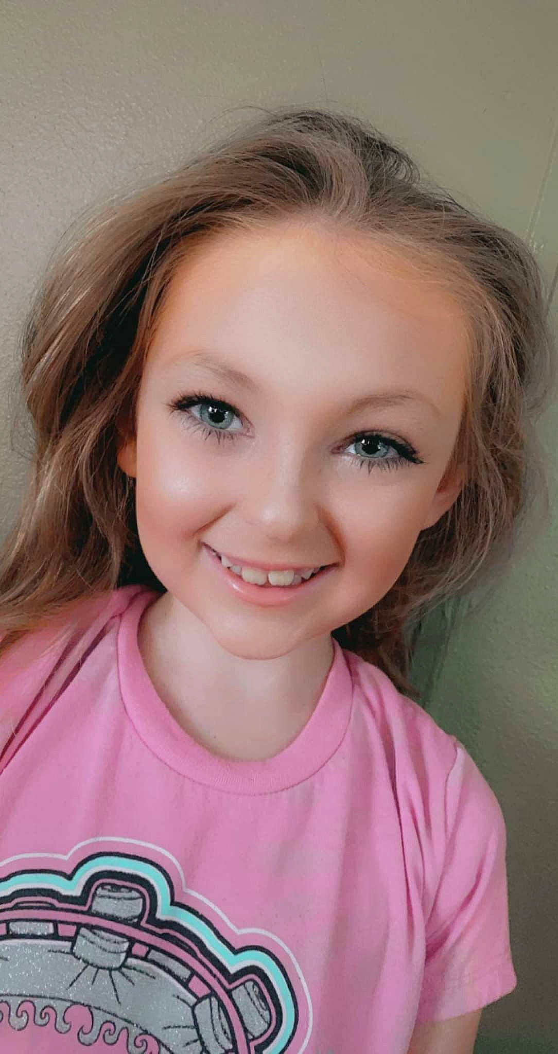 Emma is registered to the contest to win money with this photo: cheek, chin, eyebrow, eyelash, face, facial_expression, flash_photography, forehead, hair, hairstyle, iris, jaw, joy, lip, mouth, neck, nose, person, shoulder, skin