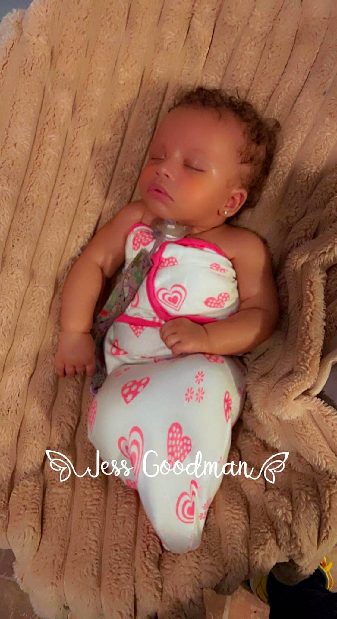 Selina is registered to the contest to win money with this photo: arm, baby, baby_toddler_clothing, cheek, comfort, dress, eye, face, head, leg, lip, mouth, nail, neck, nose, person, pink, skin, sleeve, stomach