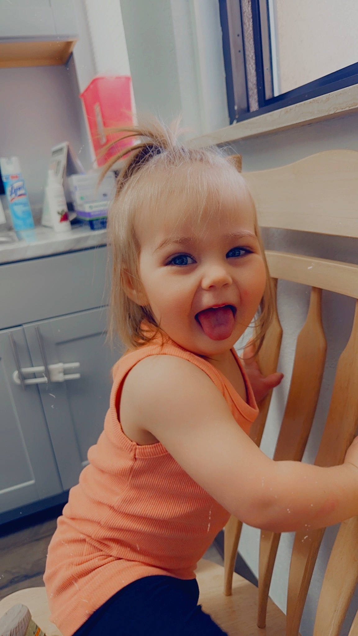 Taylor is registered to the contest to win money with this photo: baby_toddler_clothing, beauty, cabinetry, chair, cheek, child, comfort, drawer, flooring, gesture, happy, person, product, shoulder, skin, smile, standing, t_shirt, thigh, thumb