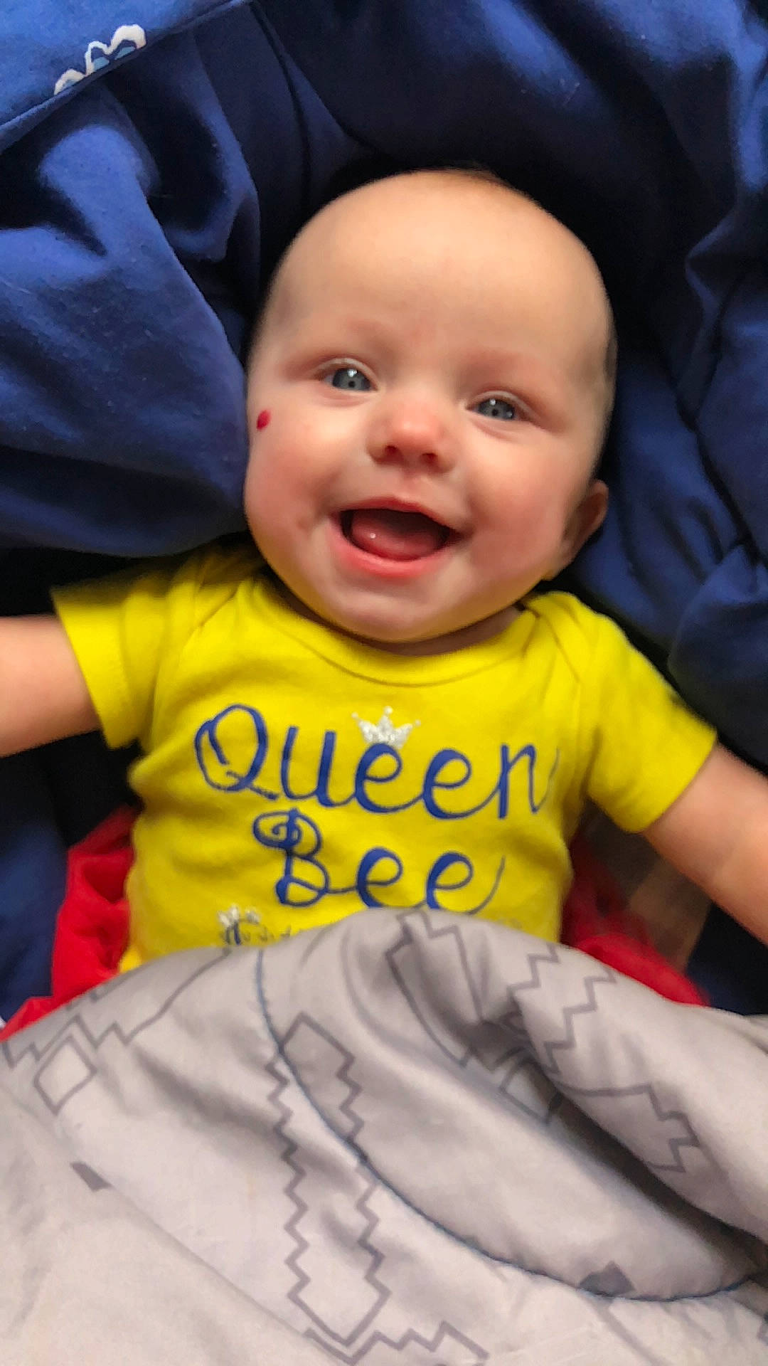 Elena is registered to the contest to win money with this photo: baby, baby_toddler_clothing, cheek, child, cool, facial_expression, finger, fun, gesture, happy, head, human, mammal, people, person, product, skin, sleeve, smile, t_shirt