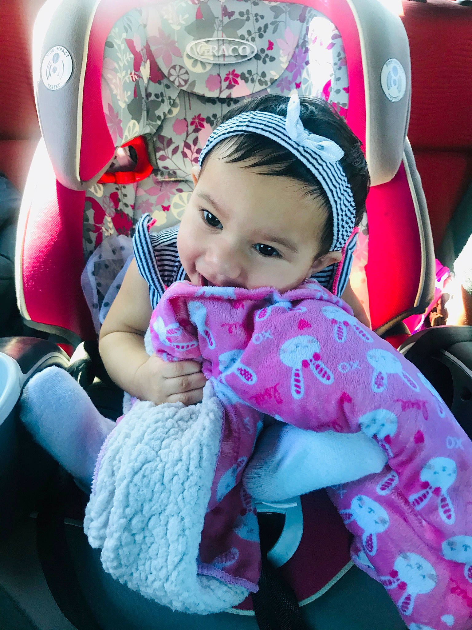 Anáis is registered to the contest to win money with this photo: baby, baby_carriage, baby_products, car_seat, cheek, child, ear, fun, head, magenta, neck, person, pink, plant, product, skin, smile, toddler, vacation