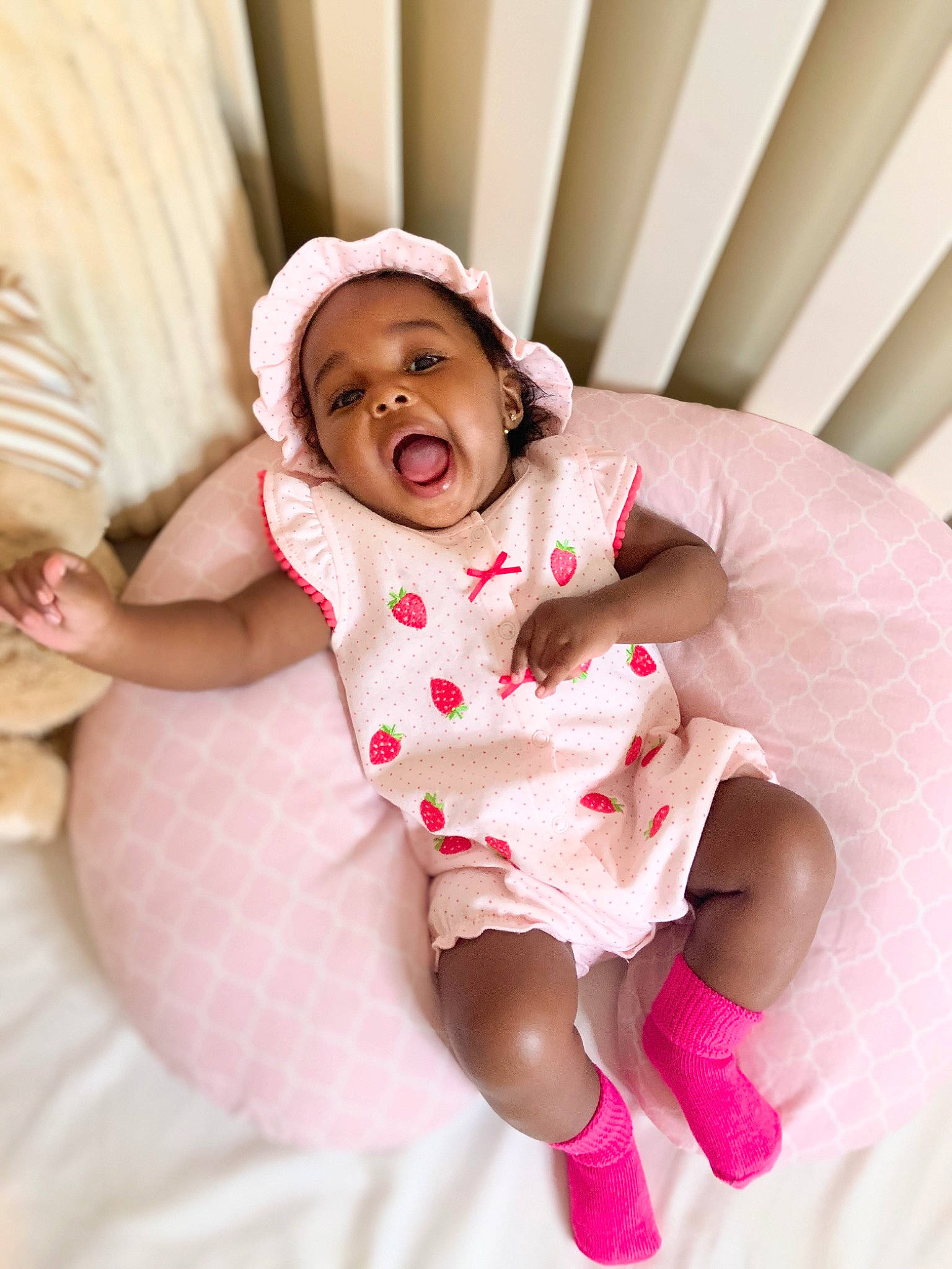 Journie is registered to the contest to win money with this photo: baby, baby_laughing, baby_sleeping, child, facial_expression, fun, happy, linens, person, pink, skin, smile, toddler