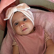 Elizabeth joined the competition — help win amazing prizes! baby, infant, headband, bow, pink, blanket, stroller, cute, child, soft, clothing, portrait, face, skin, hands, lying_down, indoors, comfort, toddler, closeup