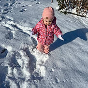 Olivia joined the competition — help win amazing prizes! child, toddler, snow, winter, outdoor, cold, hat, jacket, gloves, footprints, sunlight, shadow, nature, plants, walking, clothing, pink, white, daytime, person