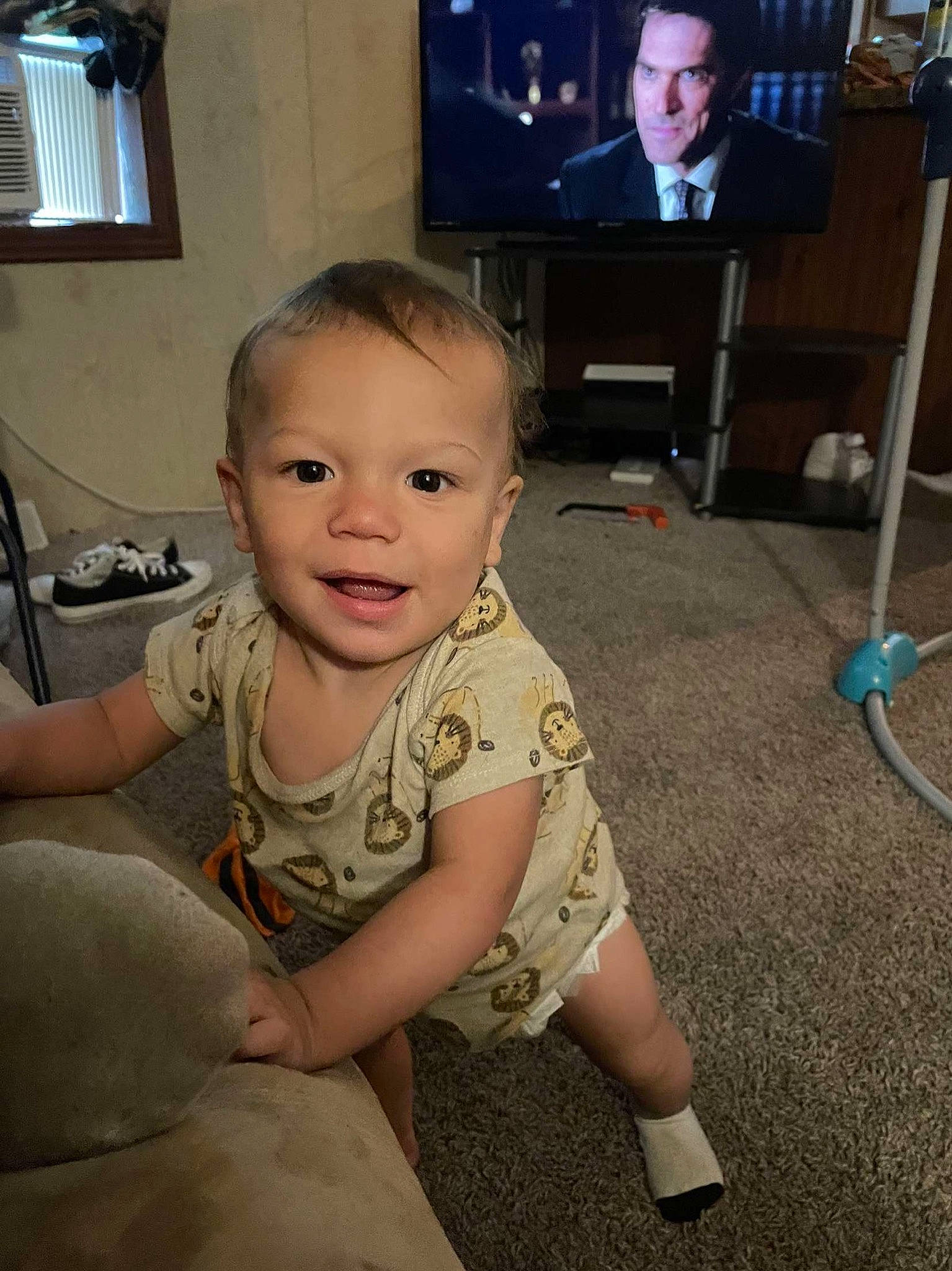 Theo is registered to the contest to win money with this photo: baby_toddler_clothing, cool, eye, face, floor, flooring, fun, hair, hairstyle, head, human_body, joint, muscle, organ, person, picture_frame, shoulder, skin, smile, standing