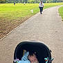 Luca joined the competition — help win amazing prizes! baby, blanket, child, daytime, dog, grass, leisure, nature, outdoor, pacifier, park, pathway, people, person, relaxing, scenery, sleeping, stroller, tree, walking