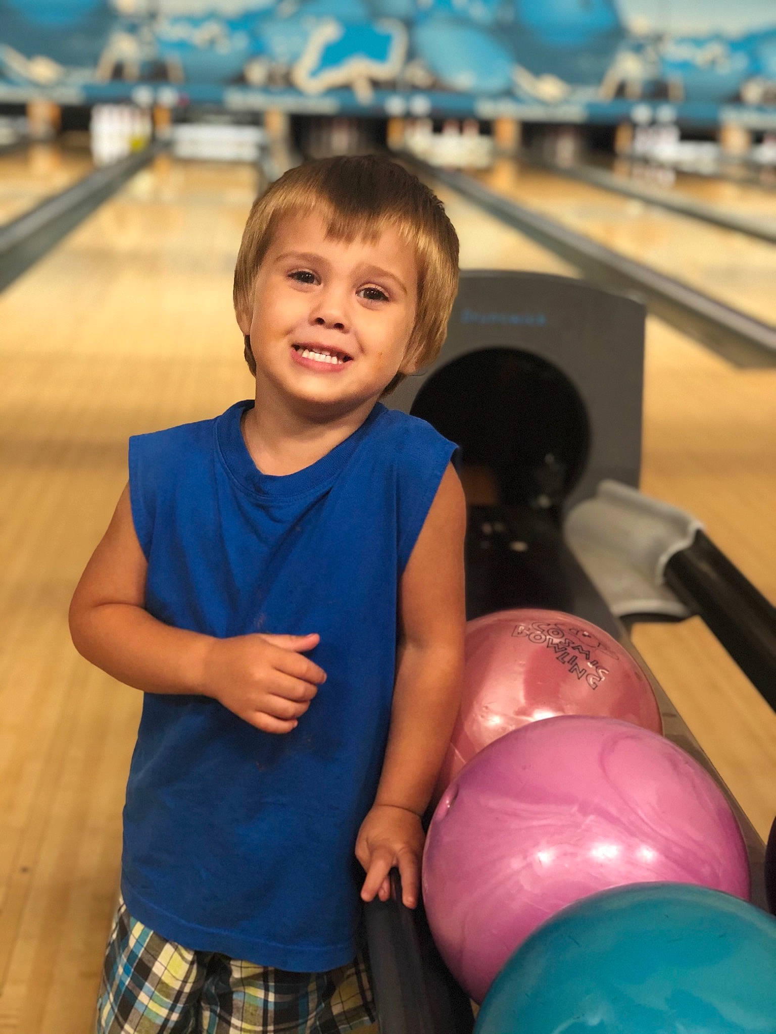 Robert is registered to the contest to win money with this photo: blue, bowling, child, clothing, electric_blue, fun, happy, joy, leisure, organ, person, photograph, plaid, recreation, skin, smile, snapshot, tartan, thigh, toddler
