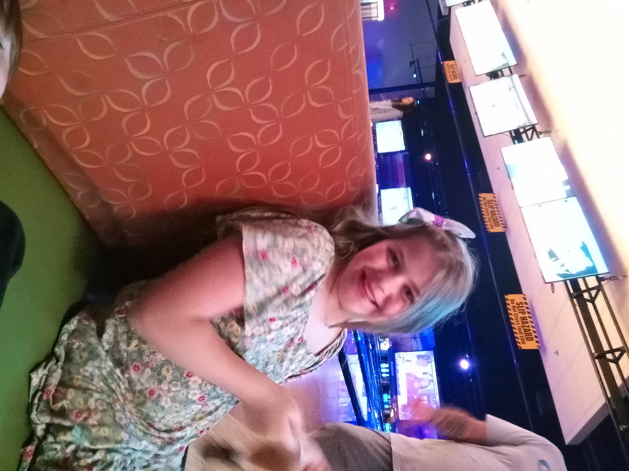 Eleanor is registered to the contest to win money with this photo: child, comfort, couch, design, electric_blue, electronic_device, flesh, fun, happy, joy, magenta, pattern, person, room, sitting, smile, t_shirt, toddler