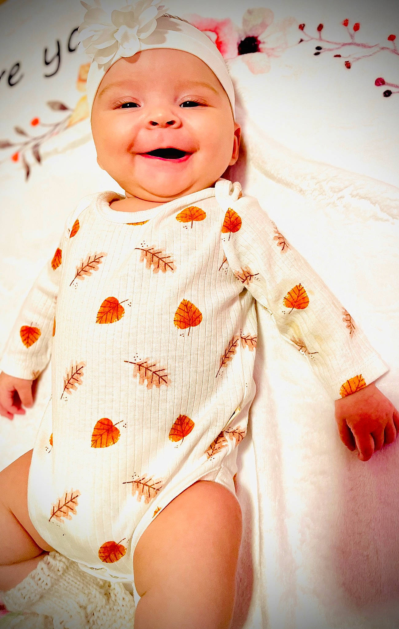 Isabella is registered to the contest to win money with this photo: baby, baby_laughing, baby_toddler_clothing, beauty, eye, face, finger, fun, happy, head, headgear, headwear, lip, mouth, orange, person, skin, sleeve, smile, thigh