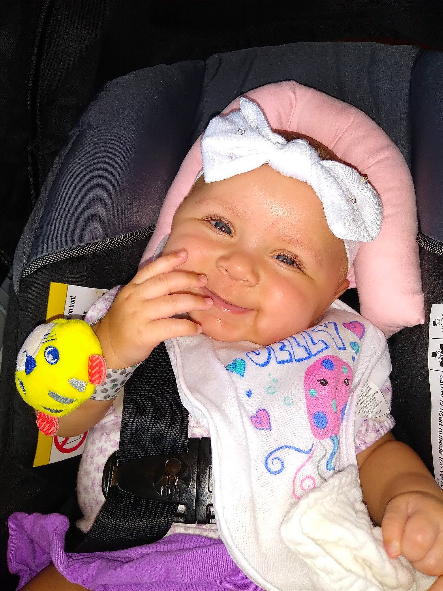 Luna joined the competition — help win amazing prizes! baby, baby_carriage, baby_toddler_clothing, black, cheek, comfort, finger, happy, headwear, iris, lip, mouth, nose, outerwear, person, pink, skin, sleeve, smile, thumb